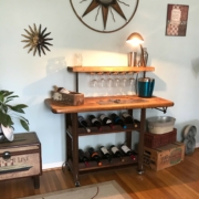 a wine rack with a desk lamp on top