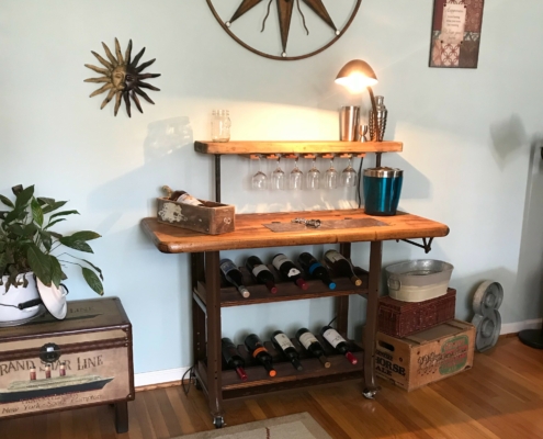 a wine rack with a desk lamp on top