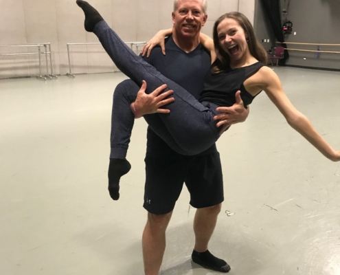 a man holding a dancer