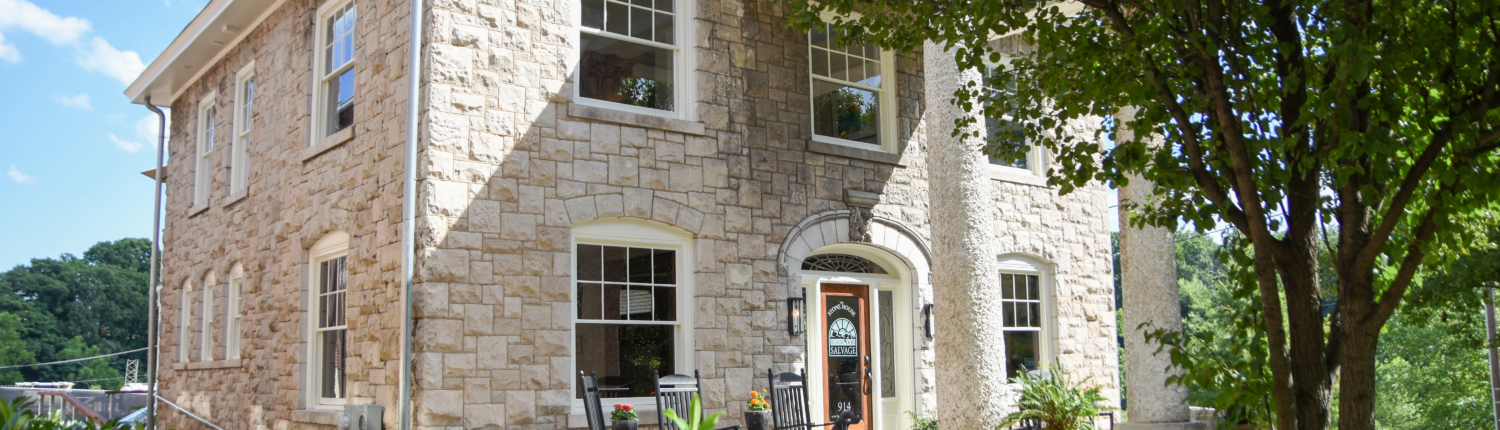 the front-yard and facade of the Stone House, Black Dog Salvage's rental property