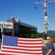 a larger American flag outside of Ballast Point Brewing Company