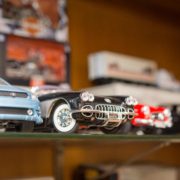 vintage model cars on a shelf at Auto Collectibles