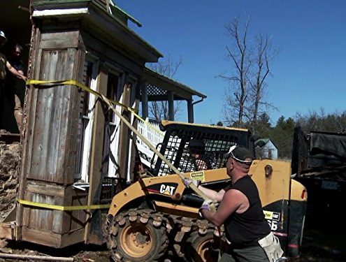 a bobcat is used to salvage the Izard House